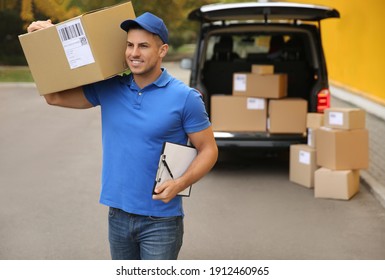 Courier with clipboard and parcel near delivery van outdoors. Space for text - Powered by Shutterstock