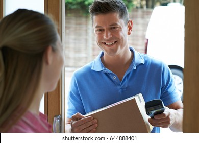 Courier Delivering Package To Domestic House