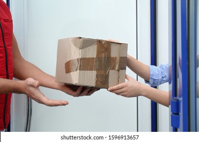 Courier Giving Damaged Cardboard Box To Client, Closeup. Poor Quality Delivery Service