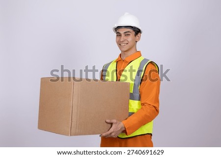 Courier holding a parcel and looking at camera