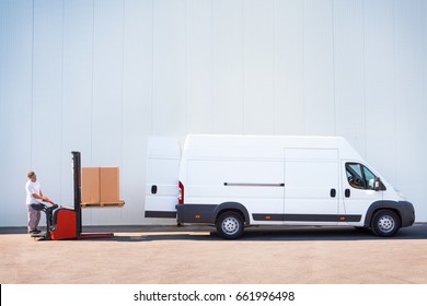 Courier Is Loading The Van With Parcels