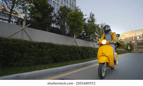 Courier man carry package moped. Guy ride yellow retro scooter city street deliver box in backpack. Fast food delivery service. Person drive bike with store bag. Express home order. Rush rider hurry. - Powered by Shutterstock