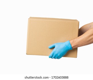 Courier Presents Cardboard Box In Rubber Gloves, Side View