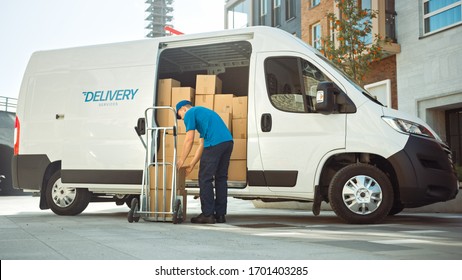 Courier Takes out Cardboard Box Package From Opened Delivery Van Side Door. Professional Courier / Loader helping you Move, Delivering Your Purchased Items Efficiently - Shutterstock ID 1701403285