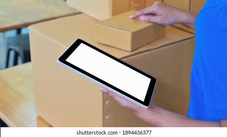 Courier Using A Digital Tablet To Verify Customer Information.