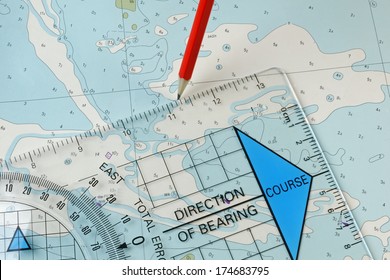 A Course Being Plotted On An Old Chart With A Pencil And Course Plotter