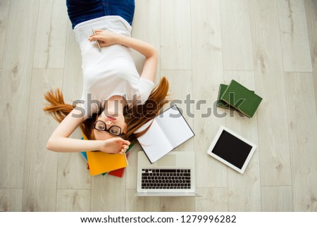 Course person people she her brainstorming  deadline teenager lazy bored boredom mind many concept. Hight top angle view portrait of unhappy sad upset teen holding hand on forehead