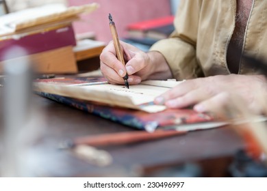 Court Clerk With Pen In Hand Writing On Parchment