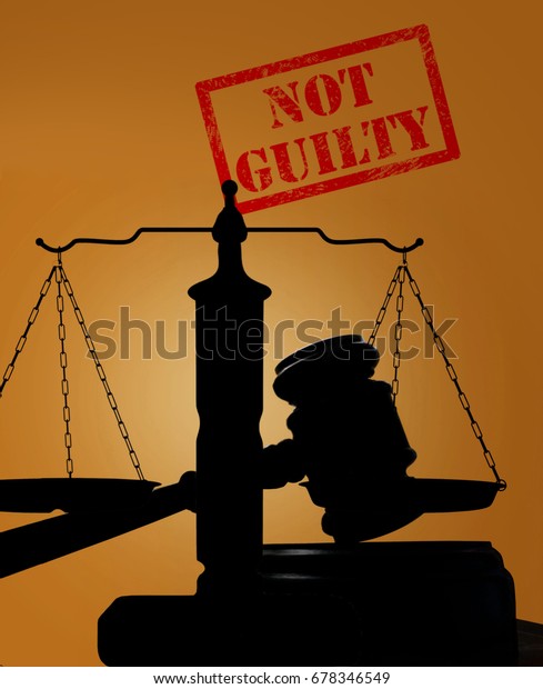 Court\
gavel and scales of justice with Not Guilty\
stamp