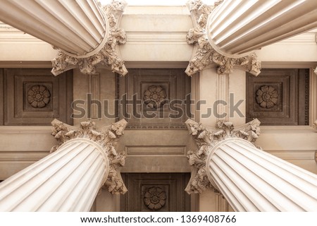 Court house or museum pillars or columns looking straight up and symmetrical 