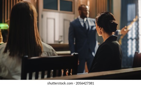 Court Of Justice And Law Trial: Female Prosecutor Listening And Writing Down Notes To The Case Presented By Lawyer To Judge, Jury. Attorney Lawyer Protecting Client With Closing Not Guilty Arguments.