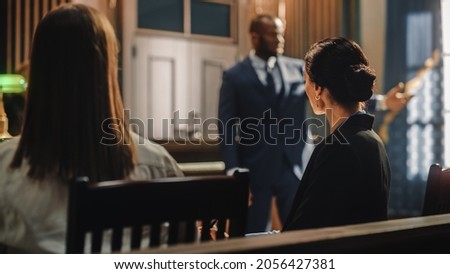 Court of Justice and Law Trial: Female Prosecutor Listening and Writing Down Notes to the Case Presented by Lawyer to Judge, Jury. Attorney Lawyer Protecting Client with Closing Not Guilty Arguments.