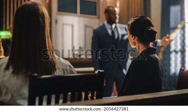 Court of Justice and Law Trial: Female\
Prosecutor Listening and Writing Down Notes to the Case Presented\
by Lawyer to Judge, Jury. Attorney Lawyer Protecting Client with\
Closing Not Guilty\
Arguments.