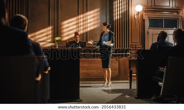Court of Justice and Law Trial: Successful\
Female Prosecutor Presenting the Case, Making Passionate Speech to\
Judge, Jury. Attorney Lawyer Protecting Client with Closing Not\
Guilty Arguments.