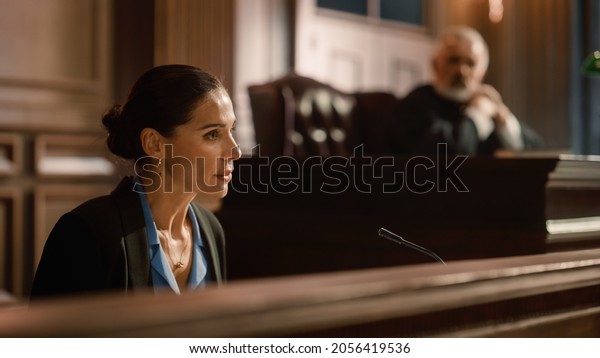 Court of Law and Justice: Portrait of\
Beautiful Female Victim Giving Heartfelt Testimony to Judge, Jury.\
Emotional Speech of Empowered Woman against Crime, Injustice,\
Prejudice, Corruption