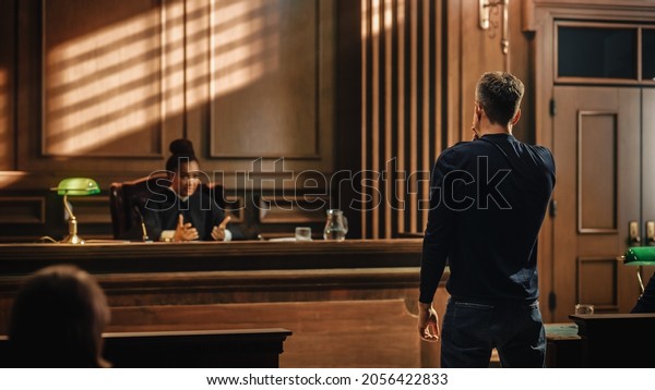 Court\
of Law and Justice Trial Proceedings: Male Law Offender is\
Questioned and Giving Testimony to Judge, Jury. Criminal Denying\
Charges, Pleading, Judge Accuses Guilty\
Defendant.