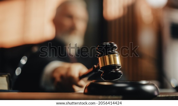 Court of Law and Justice Trial Session: Imparcial\
Honorable Judge Pronouncing Sentence, striking Gavel. Focus on\
Mallet, Hammer. Cinematic Shot of Dramatic Not Guilty Verdict.\
Close-up Shot.