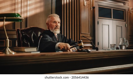 Court Of Law Trial: Portrait Of Impartial Judge Reading Decision, Striking Gavel. Justice Pronouncing Sentence. Judgment After Deliberation. Guilty, Not Guilty Verdict. Cinematic Concept Rule Of Law