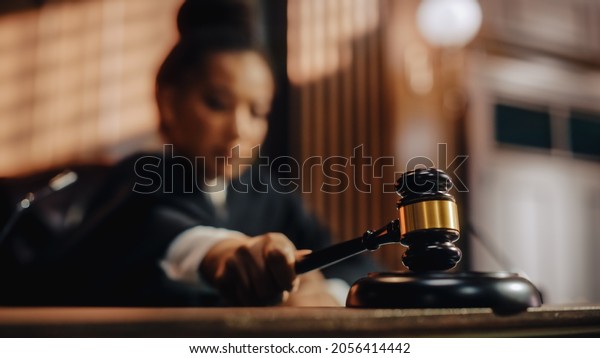 Court of\
Law Trial in Session: Honorable Female Judge Pronouncing Sentence,\
striking Gavel. Focus on Mallet, Hammer. Cinematic Shot of Dramatic\
Not Guilty Verdict. Close-up\
Shot.
