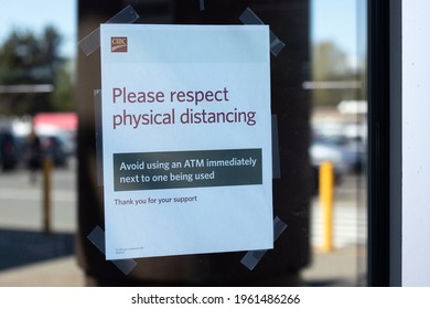 Courtenay, Canada - April 22,2021: View Of Sign On The Window Please Respect Physical Distancing Using A CIBC ATM