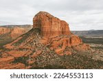Courthouse Butte Rock in red rock formations within coconino national forest in Sedona Arizona USA against white cloud background. Horizontal Image.