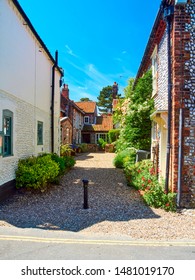 A courtyard to cottages off the high steert in Blakeney