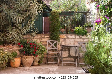 A courtyard with flowers and plants in the Mediterranean town of Rovinj. Istrian Peninsula, Croatia. - Powered by Shutterstock