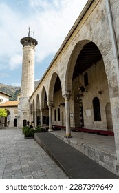 Courtyard of the old historical Habibi Neccar Mosque in Antakya (Hatay) Turkey, with its minaret on the background before the earthquake of 2023. 	