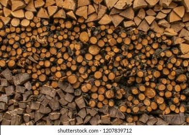 in the courtyard is a stack of firewood of different shapes