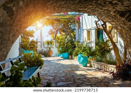 Image, Stock Photo A Mediterranean courtyard, the curved facade of a residential building and a delicate flower