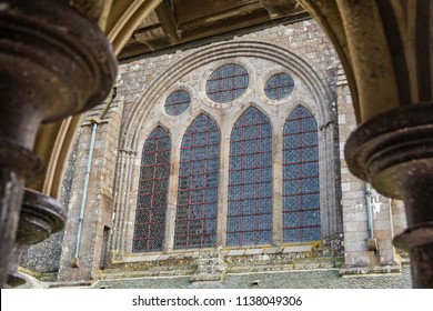 Courtyard View Of Mont Saint Michel, Looking Ancient Pillars. The Island Has Held Strategic Fortifications Since Ancient Times And Since The 8th Century AD Has Been The Seat Of The Monastery.