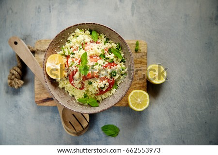 Couscous with parsley, tomato, lemon and olive oil. Traditional Arabic Salad Tabbouleh