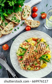 Couscous Salad With Grilled Chicken And Asparagus On White Plate. Healthy Food