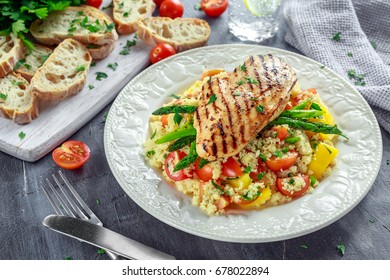 Couscous Salad With Grilled Chicken And Asparagus On White Plate. Healthy Food