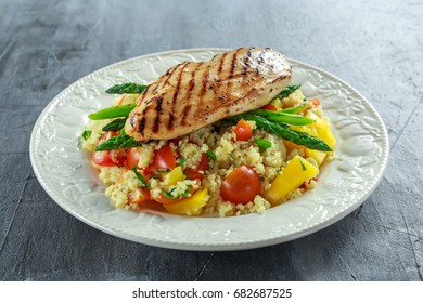 Couscous Salad With Grilled Chicken And Asparagus On White Plate. Healthy Food