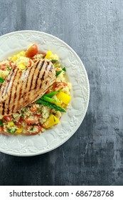 Couscous Salad With Grilled Chicken And Asparagus On White Plate. Healthy Food