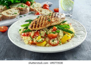 Couscous Salad With Grilled Chicken And Asparagus On White Plate. Healthy Food