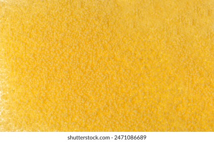 Couscous texture background top view. Dry cuscus pattern, raw kuskus wallpaper, uncooked cous cous or semolina granules with copy space