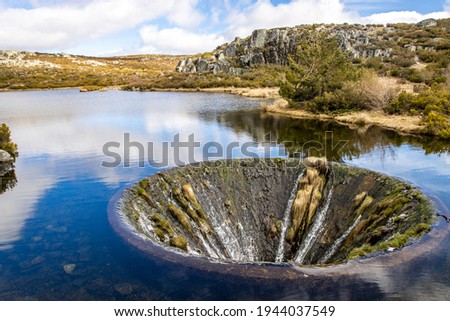 Covao Dos Conchos - A hole in the middle of the Lake in Serra da Estrela. Bell mouth spillway 