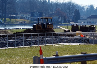 Coventry Township, Ohio / USA = 1/15/2020: Working On Damn Reconstruction With A Bulldozer On East Reservoir In The Portage Lakes On Near North Turkeyfoot Road And Portage Lakes Dr.