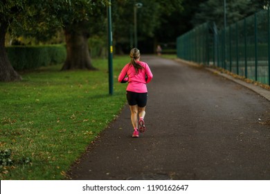 Coventry, UK - September 24, 2018: A Yound Woman Are Running In Park