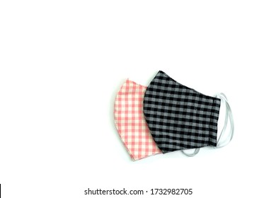 Cover mouth from polluted air with this pink mask handmade face maks. This mask is made out of cotton fabric DIY projects save for covid-19.Half of black Medical mask or surgical earloop mask isolated - Powered by Shutterstock