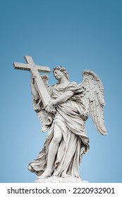 Cover page and beautiful holy angel and wings at the Saint Angel bridge at gradient blue sky background   copy space for text  Rome  Italy
