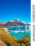 Cover page with big Perito Moreno glacier in Patagonia with blue sky and turquoise water glacial lagoon, South America, Argentina, in Autumn colors