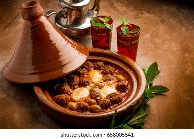 cover and tajine with meat balls eggs and green olives