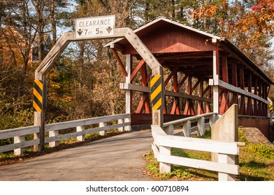 Covered Bridge West Virginia
A Red Covered Bridge In West VA Crosses Over A Small River. One Car At A Time Can Go On The Bridge And There Is A Height Restriction, Too.