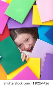 Covered By Too Much Information - Young Girl Emerging From Beneath Books