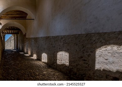 A Covered Passage Inside The Castle Of Torrechiara, Parma, Italy, From Whose Windows The Sun Filters