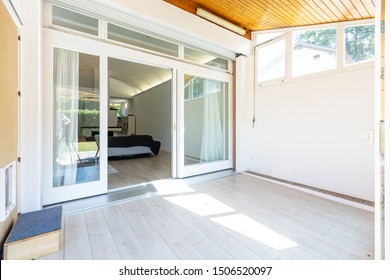 Covered veranda with access to the living room. Nobody inside - Shutterstock ID 1506520097