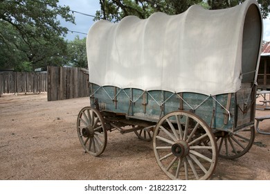 Covered wagon with green wood siding and white top